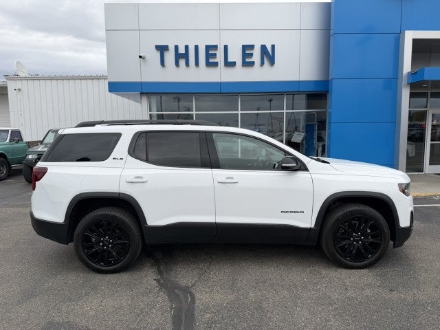 2023 GMC Acadia SLE in Summit White — front three-quarter view