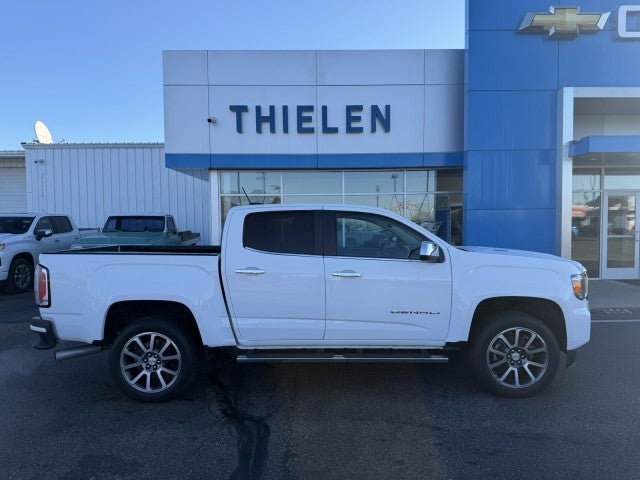 2022 GMC Canyon Denali in Summit White — front three-quarter view