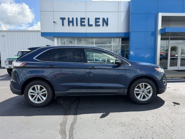 2017 Ford Edge SEL in Red — front three-quarter view